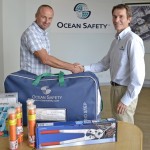 Collecting safety equipment from Mark Hart at Ocean Safety